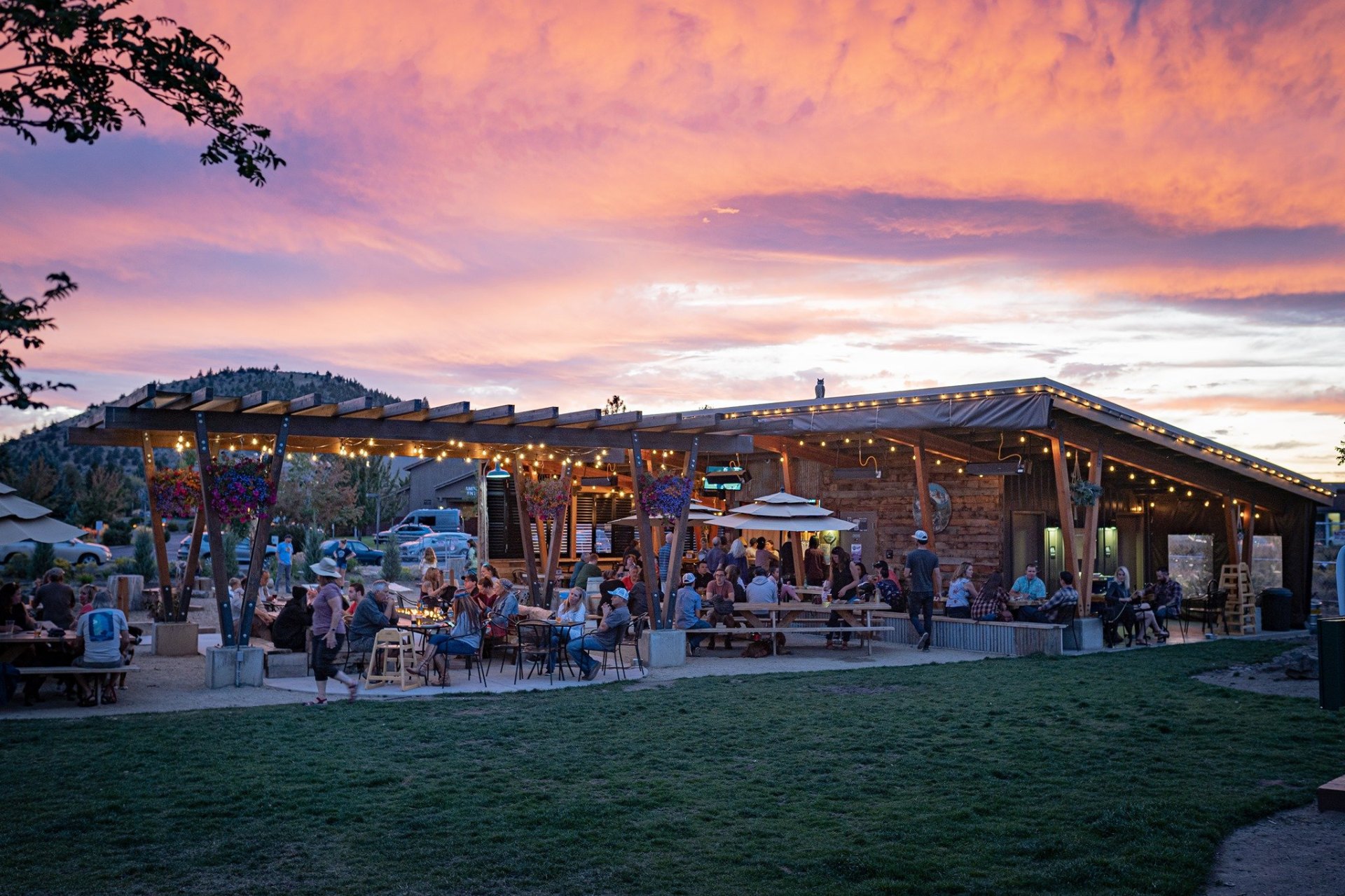 On Tap food-truck patio under a pink sunset sky