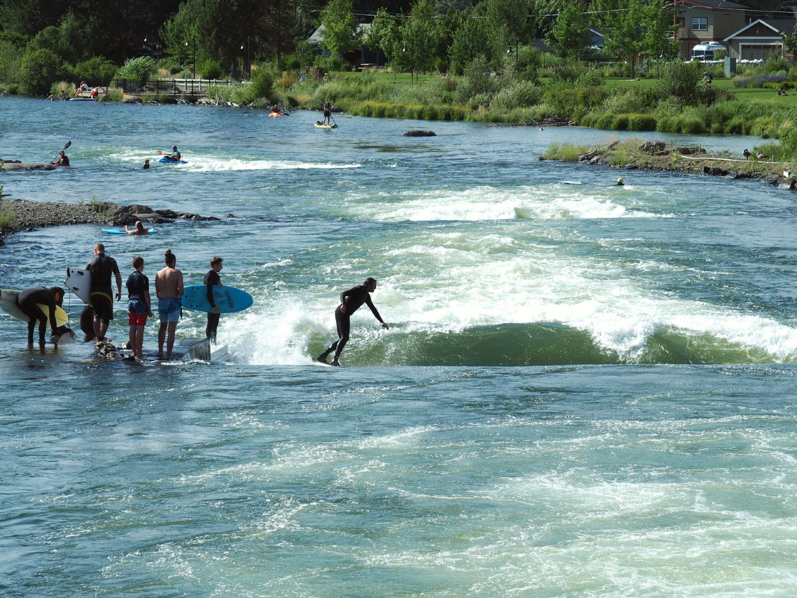 River surfer riding the standing wave at the Bend Whitewater Park