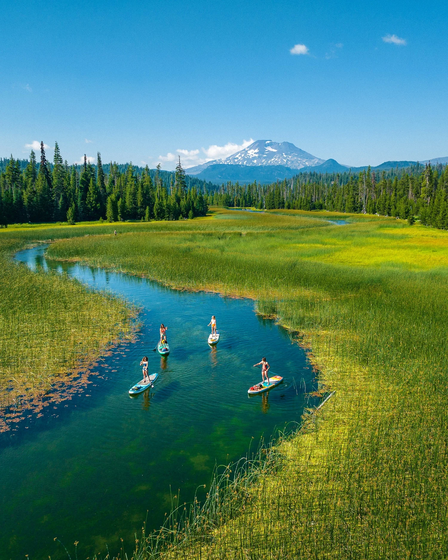 Paddleboarder on Sparks Lake at golden hour