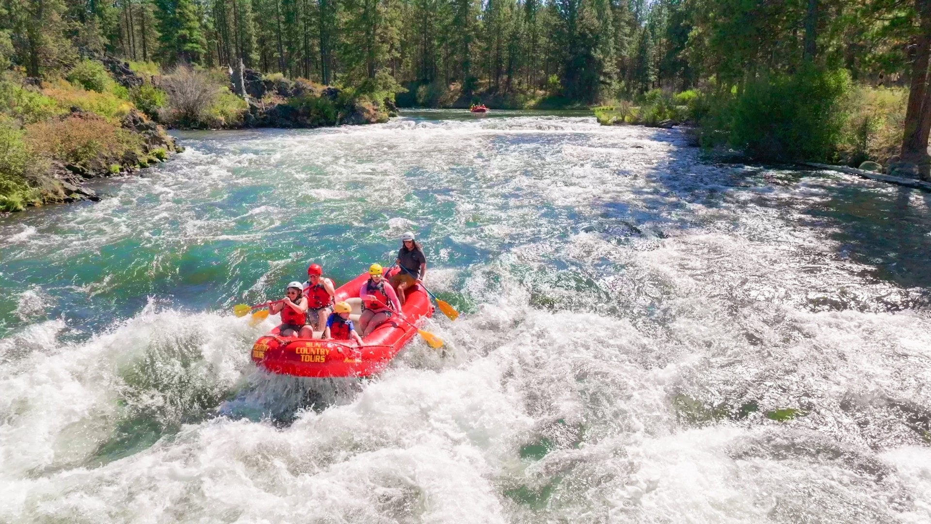 Whitewater rafters dropping into Big Eddy rapids on the Deschutes
